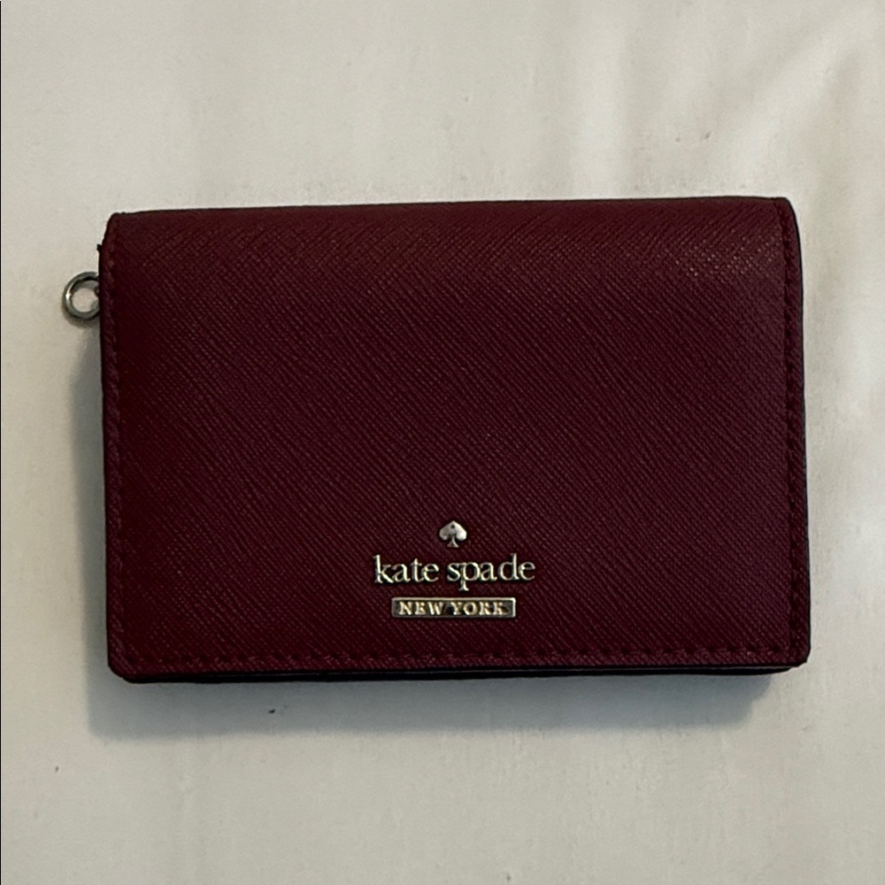 kate spade deep burgundy leather card wallet with gold-tone hardware